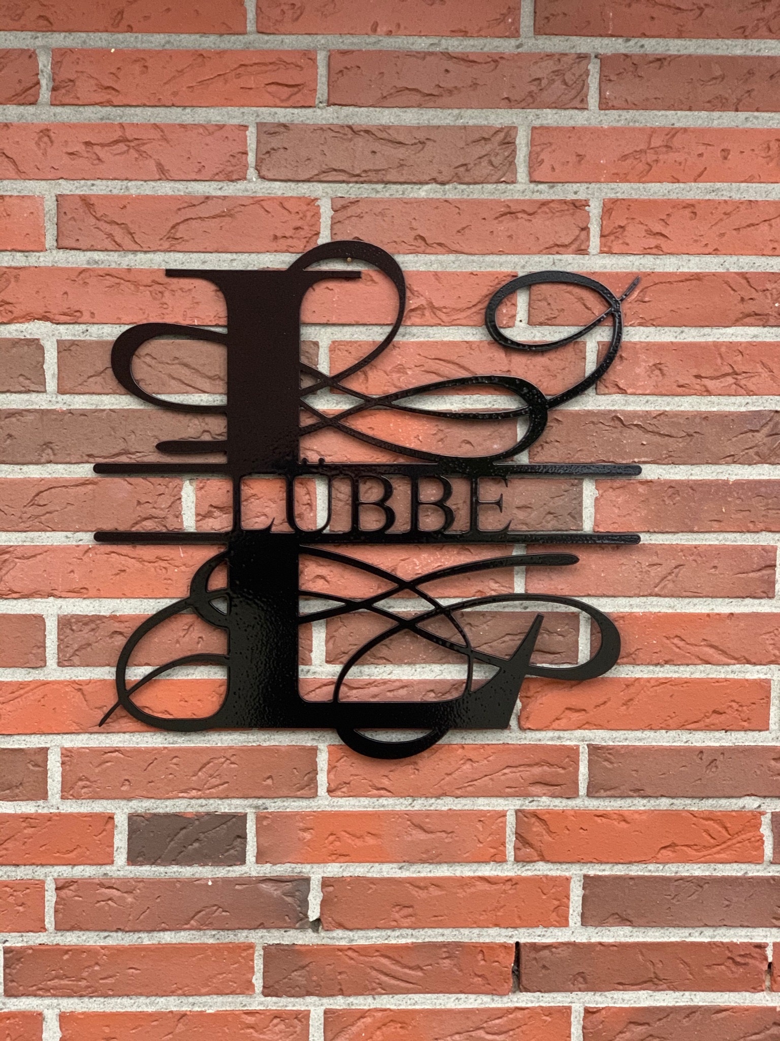 Monogramm Schriftzug Luebbe schwarz