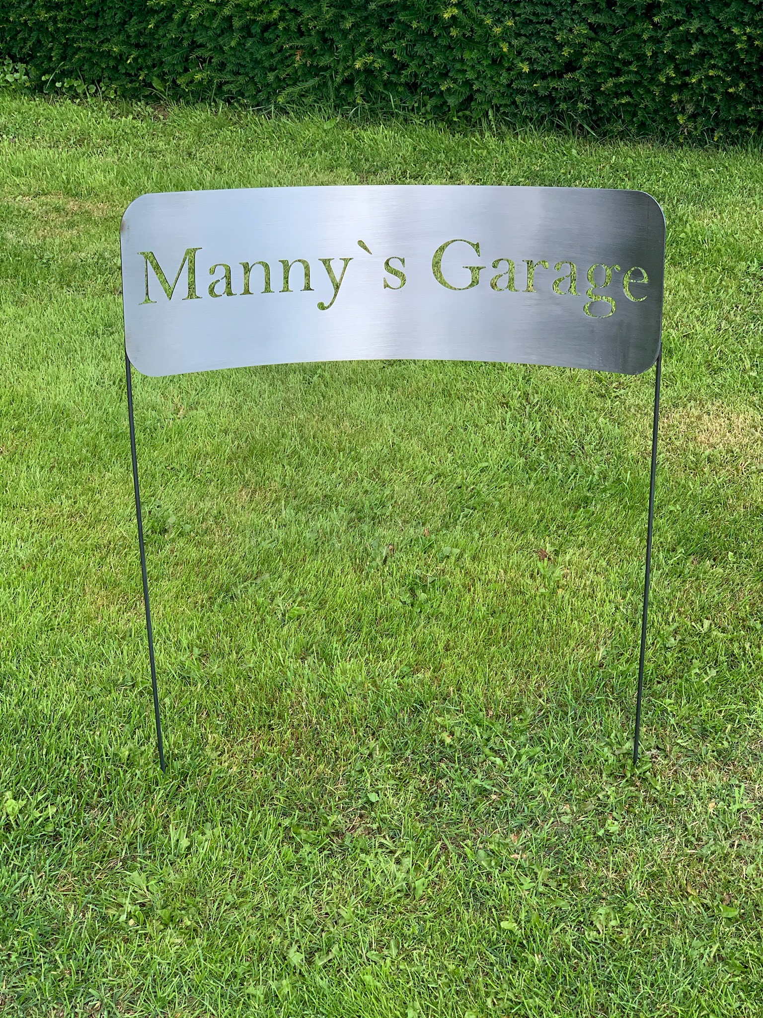 Schild Mannys Garage